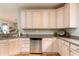 Open kitchen featuring stainless steel appliances and granite countertops at 405 Banyan Place, North Myrtle Beach, SC 29582