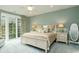 Spacious main bedroom with a sliding glass door and ample natural light at 405 Banyan Place, North Myrtle Beach, SC 29582
