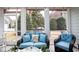 Bright and airy sunroom with comfortable seating and views of the lush backyard at 405 Banyan Place, North Myrtle Beach, SC 29582