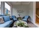 Charming sunroom with comfortable seating, beach-themed decor, and access to the stairs at 405 Banyan Place, North Myrtle Beach, SC 29582