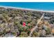 Breathtaking ocean view from this wooded lot, offering tranquility near the water's edge at 410 44Th Ave. N, Myrtle Beach, SC 29577