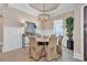 Dining room with wainscoting, chandelier and large windows for natural light at 410 44Th Ave. N, Myrtle Beach, SC 29577