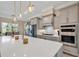 Open kitchen with large island, stainless appliances, and pendant lighting at 410 44Th Ave. N, Myrtle Beach, SC 29577