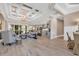 Open-concept living room featuring coffered ceilings and luxury vinyl plank flooring at 410 44Th Ave. N, Myrtle Beach, SC 29577
