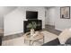 Cozy living room with a modern media console, decorative pillows, and a neutral color palette at 434 Myrtle Meadows Dr, Conway, SC 29526