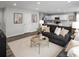 Open-concept living room with modern decor, comfortable seating, and seamless flow to the kitchen at 434 Myrtle Meadows Dr, Conway, SC 29526
