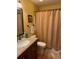 A full bathroom has a granite countertop vanity and a shower with patterned curtain at 4633 Lightkeepers Way # 5K, Little River, SC 29566