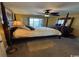 Main bedroom with a four-poster bed, a ceiling fan and carpet flooring at 4633 Lightkeepers Way # 5K, Little River, SC 29566
