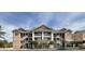 Attractive condo building with multi-level balconies, neutral siding, and well-kept landscaping at 4633 Lightkeepers Way # 5K, Little River, SC 29566