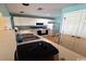 Functional kitchen featuring white cabinets, a dual basin sink and modern appliances with a bar counter at 4633 Lightkeepers Way # 5K, Little River, SC 29566