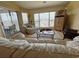 Cozy living room boasts comfortable seating, natural light, and sliding door access to the outside at 4633 Lightkeepers Way # 5K, Little River, SC 29566
