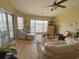 Bright living room with comfortable seating, and marina views at 4633 Lightkeepers Way # 5K, Little River, SC 29566