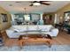 Relaxing living room with ceiling fan, comfortable seating, and views into the kitchen and dining area at 4633 Lightkeepers Way # 5K, Little River, SC 29566