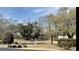 Scenic view of a pond with a fountain surrounded by lush trees and manicured landscaping at 4633 Lightkeepers Way # 5K, Little River, SC 29566