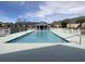 Community pool with white fence, with covered seating area in the background at 4633 Lightkeepers Way # 5K, Little River, SC 29566