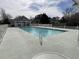 Community pool with a building and an American flag in the background at 4633 Lightkeepers Way # 5K, Little River, SC 29566