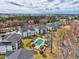 Birds eye view of condo buildings, lush scenery, swimming pool, and city skyline at 473 White River Dr. # C, Myrtle Beach, SC 29579