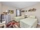 Inviting bedroom featuring two twin beds, neutral wall colors, and unique wall decor at 473 White River Dr. # C, Myrtle Beach, SC 29579