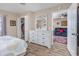 Bedroom featuring an ample dresser, a closet, and a glimpse into the cozy living room at 473 White River Dr. # C, Myrtle Beach, SC 29579