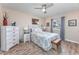 Comfortable bedroom with a ceiling fan, a large bed, matching nightstands, and a view to the outdoors at 473 White River Dr. # C, Myrtle Beach, SC 29579