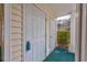 Exterior shot showing white doors with covered entry and outdoor storage at 473 White River Dr. # C, Myrtle Beach, SC 29579