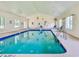 Inviting indoor pool area with bright lighting and comfortable lounging space at 473 White River Dr. # C, Myrtle Beach, SC 29579