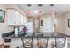 Bright kitchen featuring bar seating, sleek countertops, white appliances, and stylish pendant lights at 473 White River Dr. # C, Myrtle Beach, SC 29579