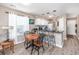 Eat-in kitchen with dark granite counter tops, white cabinets, stainless steel appliances, pendant lighting and wood flooring at 473 White River Dr. # C, Myrtle Beach, SC 29579
