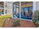 Relaxing screened porch featuring comfortable seating and view of the landscaped yard at 473 White River Dr. # C, Myrtle Beach, SC 29579