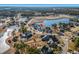 An overhead view showcases this stunning home nestled within a vibrant lakeside community at 481 Starlit Way, Myrtle Beach, SC 29579