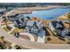Stunning aerial view of home on waterfront lot, featuring lush landscaping and private driveway at 481 Starlit Way, Myrtle Beach, SC 29579