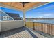 A covered back porch with a wood ceiling overlooking a picturesque waterfront view at 481 Starlit Way, Myrtle Beach, SC 29579