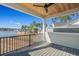 An outdoor back porch area with a wood ceiling overlooks a scenic waterfront view at 481 Starlit Way, Myrtle Beach, SC 29579