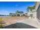 Backyard view with patio, trees, and lakefront access in a serene setting at 481 Starlit Way, Myrtle Beach, SC 29579