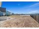 Spacious backyard overlooking the lake, with views of the neighboring houses at 481 Starlit Way, Myrtle Beach, SC 29579