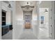 Beautiful hallway with wainscoting, tray ceiling, and view to a bright office at 481 Starlit Way, Myrtle Beach, SC 29579