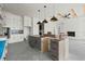 Spacious kitchen with gray island, white brick fireplace, and unique ceiling design at 481 Starlit Way, Myrtle Beach, SC 29579