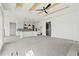 Expansive living area with views to the kitchen and abundant natural light from sliding glass doors at 481 Starlit Way, Myrtle Beach, SC 29579
