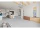 Open floor plan with kitchen island, wood beam ceiling, and bright airy interior at 481 Starlit Way, Myrtle Beach, SC 29579