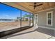Screened-in patio with wood ceiling, view of lake and neighborhood homes at 481 Starlit Way, Myrtle Beach, SC 29579