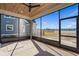 Screened-in patio with wood ceiling, view of the lawn and beautiful lake at 481 Starlit Way, Myrtle Beach, SC 29579