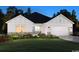 Charming single-story home featuring stone accents, a manicured lawn, and an attached two-car garage at 5040 Riverton Ct, Myrtle Beach, SC 29579