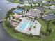 Aerial view of the community amenity center featuring a pool, tennis courts, and clubhouse at 5220 Mount Pleasant Dr., Myrtle Beach, SC 29579