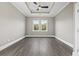 Inviting bedroom with trey ceiling, large windows offering serene views, and ample space for personalization and comfort at 5220 Mount Pleasant Dr., Myrtle Beach, SC 29579