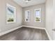 Bright and airy bedroom with multiple windows offering ample natural light and scenic neighborhood views at 5220 Mount Pleasant Dr., Myrtle Beach, SC 29579