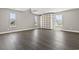 Spacious bonus room with multiple windows and a large shelving unit at 5220 Mount Pleasant Dr., Myrtle Beach, SC 29579