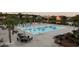 Large community pool with palm trees and lounge chairs for residents at 5220 Mount Pleasant Dr., Myrtle Beach, SC 29579