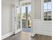 Welcoming foyer with view to covered porch through glass paned front door at 5220 Mount Pleasant Dr., Myrtle Beach, SC 29579