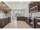 Well-equipped kitchen with stainless steel appliances, quartz countertops, and dark wood cabinetry at 5220 Mount Pleasant Dr., Myrtle Beach, SC 29579