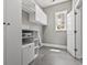 Well-lit laundry room with storage cabinets and shelving at 5220 Mount Pleasant Dr., Myrtle Beach, SC 29579